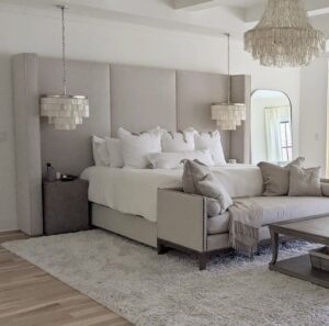 A view of a cozy white bedroom